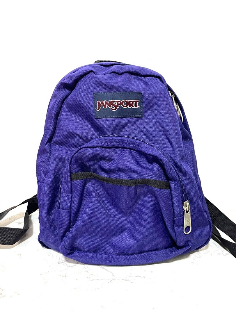 Authentic Jansport Half Pint Mini Backpack in Purple 💯 (Category: Backpacks) located in Quezon City. Submitted by declutterbybd (Listing ID 1389827840, Image 1). Description: 100% Authentic Guaranteed. Used 2x only (Big markdown LP, need to declutter) Item Details * Size msrmt — Height 11.2” x Width 9.8” x depth 4.1” (bag capacity 10.2L) * Color - Dark Purple /Violet * Water resistant * Condition: Good as new. Used only twice. Stored-well so the