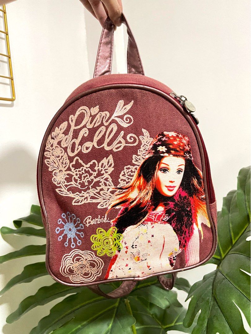 Barbie Mini Backpack in Denim Maroon (Original) 💯 (Category: Backpacks) located in Quezon City. Submitted by declutterbybd (Listing ID 1389834688, Image 3). Description: 100% Authentic Guaranteed — Pre-loved (Big markdown, need to declutter) Item Details * Size - Mini/Small * Color - Denim Red / Maroon * Condition: Lightly used. There’s a slight sign of usage but overall still in good condition. No major damage/stain. Stored-well in closet. *Aju