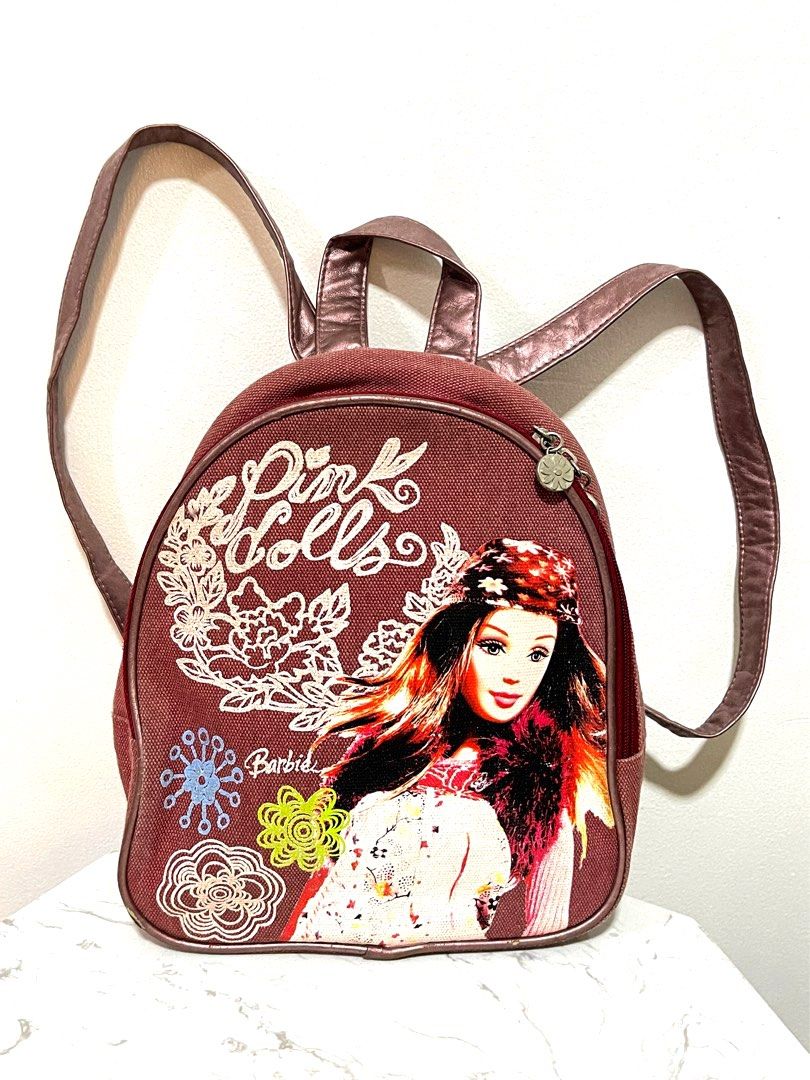 Barbie Mini Backpack in Denim Maroon (Original) 💯 (Category: Backpacks) located in Quezon City. Submitted by declutterbybd (Listing ID 1389834688, Image 2). Description: 100% Authentic Guaranteed — Pre-loved (Big markdown, need to declutter) Item Details * Size - Mini/Small * Color - Denim Red / Maroon * Condition: Lightly used. There’s a slight sign of usage but overall still in good condition. No major damage/stain. Stored-well in closet. *Aju