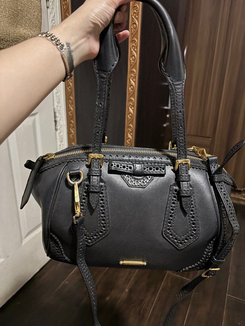 Authentic Burberry Black Leather Bridle brogue Bag (Category: Luxury Bags & Wallets) located in Cavite. Submitted by cbmae (Listing ID 1389827784, Image 1). Description: very well used, minimal signs of use, with original strap.