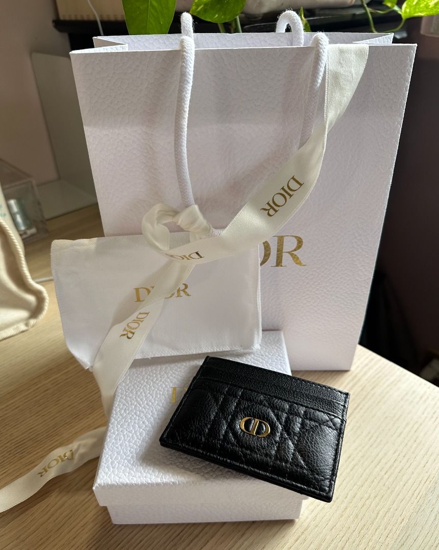 Dior Card Holder Black Calfskin (Category: Wallets & Card holders) located in Paranaque City. Submitted by lioraverse (Listing ID 1389723221, Image 2). Description: Timeless Dior elegance in a compact form — the Caro Freesia card holder in black supple calfskin with signature Cannage stitching. Slim yet functional with 5 card slots. PHP 19,000 (Retail: PHP 23,500) Authentic, purchased from Dior Used once, excellent condition Includes dust bag, pa