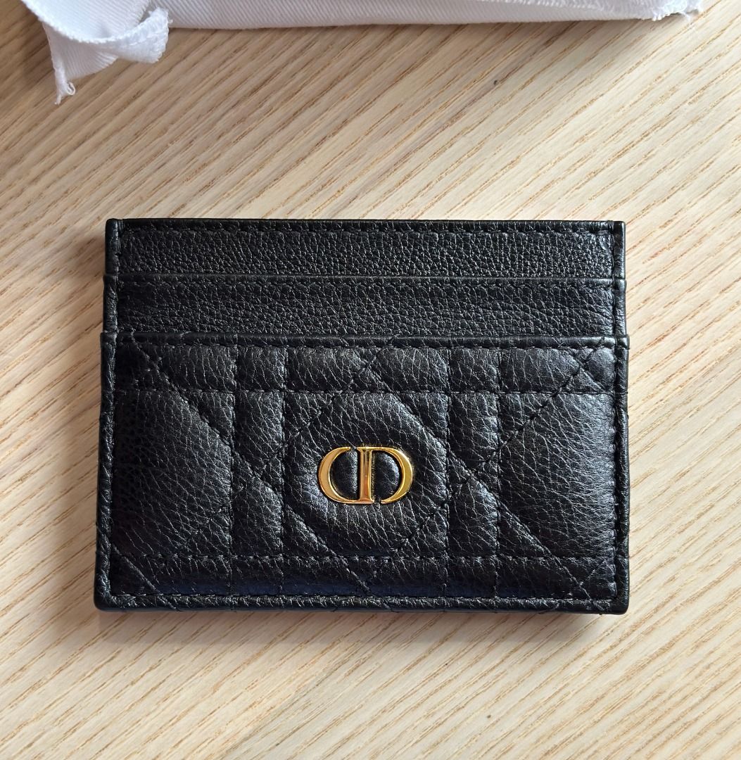 Dior Card Holder Black Calfskin (Category: Wallets & Card holders) located in Paranaque City. Submitted by lioraverse (Listing ID 1389723221, Image 1). Description: Timeless Dior elegance in a compact form — the Caro Freesia card holder in black supple calfskin with signature Cannage stitching. Slim yet functional with 5 card slots. PHP 19,000 (Retail: PHP 23,500) Authentic, purchased from Dior Used once, excellent condition Includes dust bag, pa