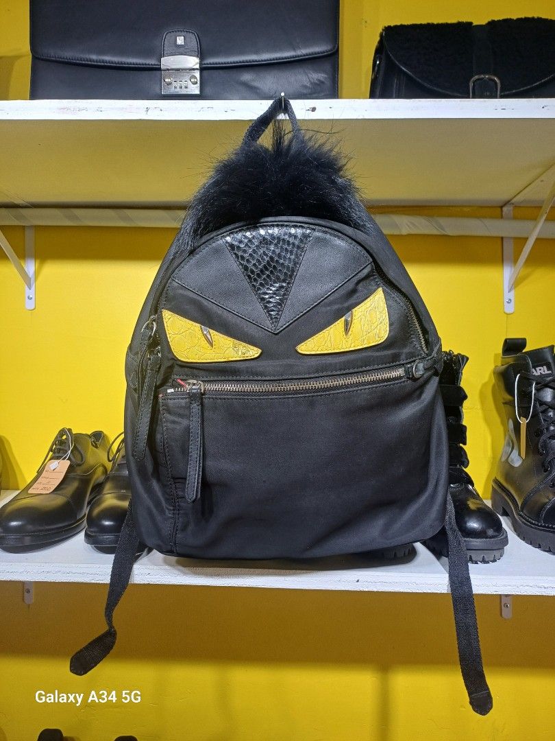 Fendi Black Medium Monster Backpack Yellow (Category: Luxury Bags & Wallets) located in Manila. Submitted by street_wear (Listing ID 1389756532, Image 3). Description: Fendi Black Medium Monster Backpack Yellow Lightly Used 8.5/10.