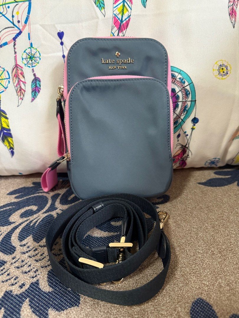 FREE SF Original Kate Spade CP Holder Sling (Category: Cross-body Bags) located in Lucena. Submitted by sgp1013 (Listing ID 1389846396, Image 2). Description: Only used once Still looks brand new, no tags Guaranteed original or your money back RFS: too many bags, result of impulse buying FIXED PRICE, this is already a good deal.