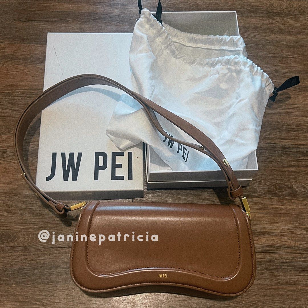 JW PEI Joy Bag - Brown (Category: Luxury Bags & Wallets) located in Pasay City. Submitted by janinepatricia (Listing ID 1389782324, Image 1). Description: Original. Authentic. Bought from JW PEI for 5.2k. Well-used, well-loved. Has some light scratches but barely noticeable. Check photos (last 2 photos from JW PEI website just to show how it is when worn). Comes with box and dust bag. RFS: decluttering. Major Material: Vegan Leather Lining Materi