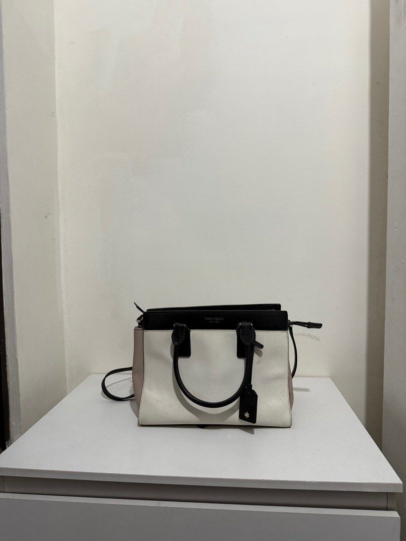 kate spade cameron satchel (Category: Shoulder Bags) located in Manila. Submitted by 910pt (Listing ID 1389806950, Image 1). Description: i actually have only used this for less than 5 times. nastock lang sa house kaya meron stain idk where from. needs cleaning but is still well presentable. Sobrnag ayos pa po ng loob and labas niya, madumi lang. NO LOWBALLERS THIS IS AUTHENTIC mura rin bibigay because this is for pick up only via lalamove. thank