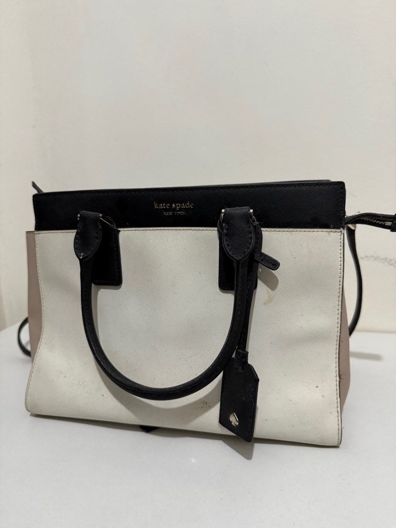 kate spade cameron satchel (Category: Shoulder Bags) located in Manila. Submitted by 910pt (Listing ID 1389806950, Image 2). Description: i actually have only used this for less than 5 times. nastock lang sa house kaya meron stain idk where from. needs cleaning but is still well presentable. Sobrnag ayos pa po ng loob and labas niya, madumi lang. NO LOWBALLERS THIS IS AUTHENTIC mura rin bibigay because this is for pick up only via lalamove. thank