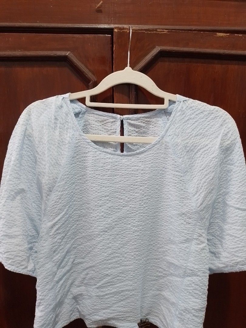 light blue blouse (Category: Blouses) located in Quezon City. Submitted by happyleafff (Listing ID 1389711267, Image 1). Description: Brand: N/A Light blue cropped blouse, slightly see through Size: Can fit S-M frame Used it twice Rfs: decluttering - no when worn & rush shipping - items are preloved. please manage expectations. - pay as you order. - mode of payment: gcash, bdo.