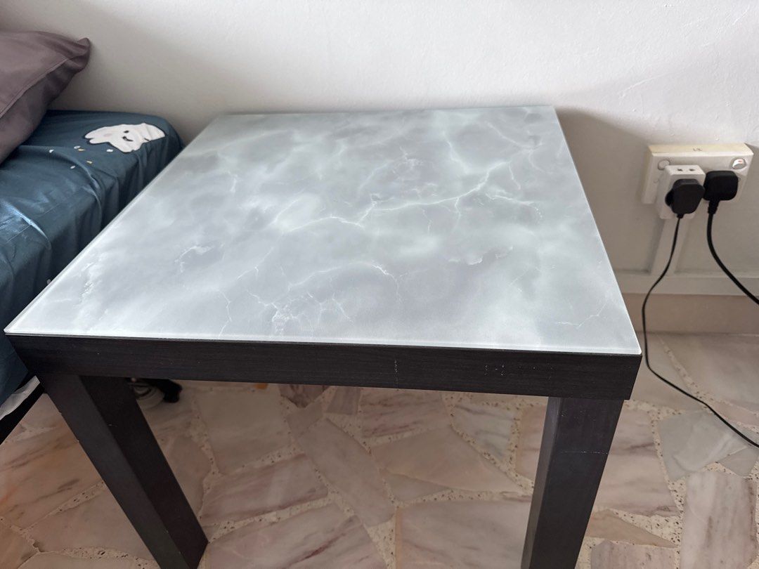 Side Table (Category: Tables & Sets) located in Singapore. Submitted by hero1311 (Listing ID 1389706177, Image 3). Description: - Stylish side table - Marble-look top - Dark wooden legs - Dimensions: 55cmx 55cm and high 46cm. - Ideal for living room or bedroom.