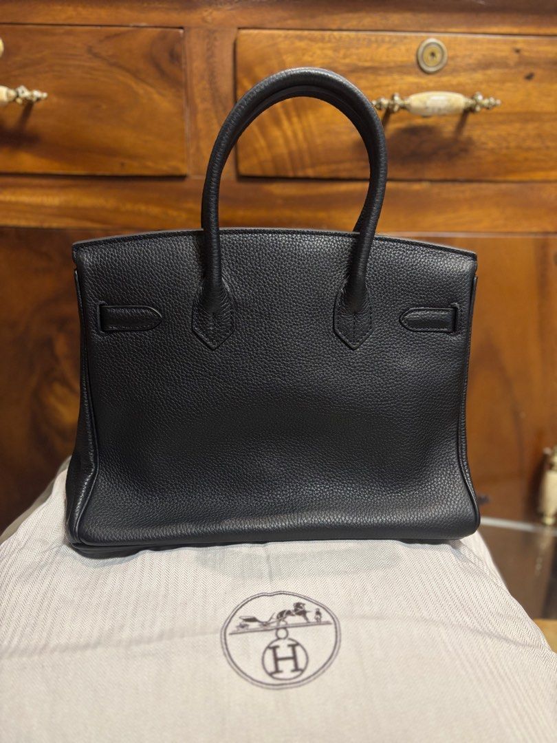 Preloved Birkin Clemence Black 30 (Category: Luxury Bags & Wallets) located in Imus. Submitted by bagsofblessings24 (Listing ID 1389697127, Image 2). Description: Preloved Birkin Clemence Black 30 Togo leather Like new with thick dustbag Smells leather, excellent condition, no issues except for missing clochette (little key holder) Keys match the lock number No certificate of authenticity since this is preloved so authentication is c/o buyer Japa