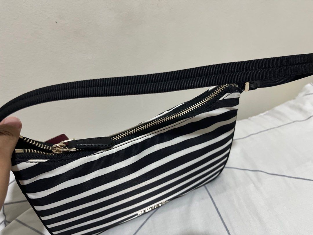 SELLING LOW: SAM NYLON SHOULDER (Category: Luxury Bags & Wallets) located in Quezon City. Submitted by dropshopselections (Listing ID 1389684278, Image 3). Description: original unused approx 9.5 x 6 x 3.5 inches.