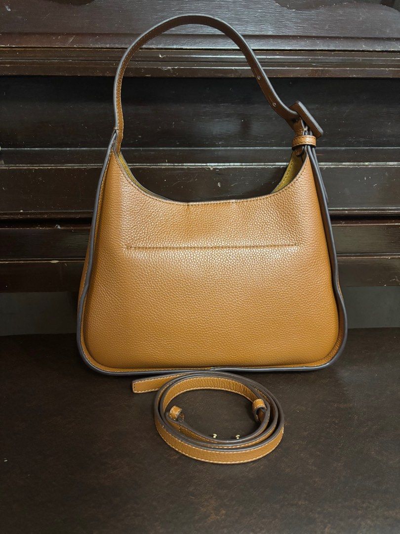 Tory Burch 2 way Leather bag (Category: Luxury Bags & Wallets) located in Imus. Submitted by bagsofblessings24 (Listing ID 1389671794, Image 3). Description: Preloved but like new Tory Burch Shoulder or sling/cross body bag Genuine leather, lightweight Excellent condition, no flaws, smells like new Medium size, can fit long wallet, snap closure Length 11in x Height 7in x Bottom 2.5in Pm to make reasonable offer With coded tag as authentic- not a 