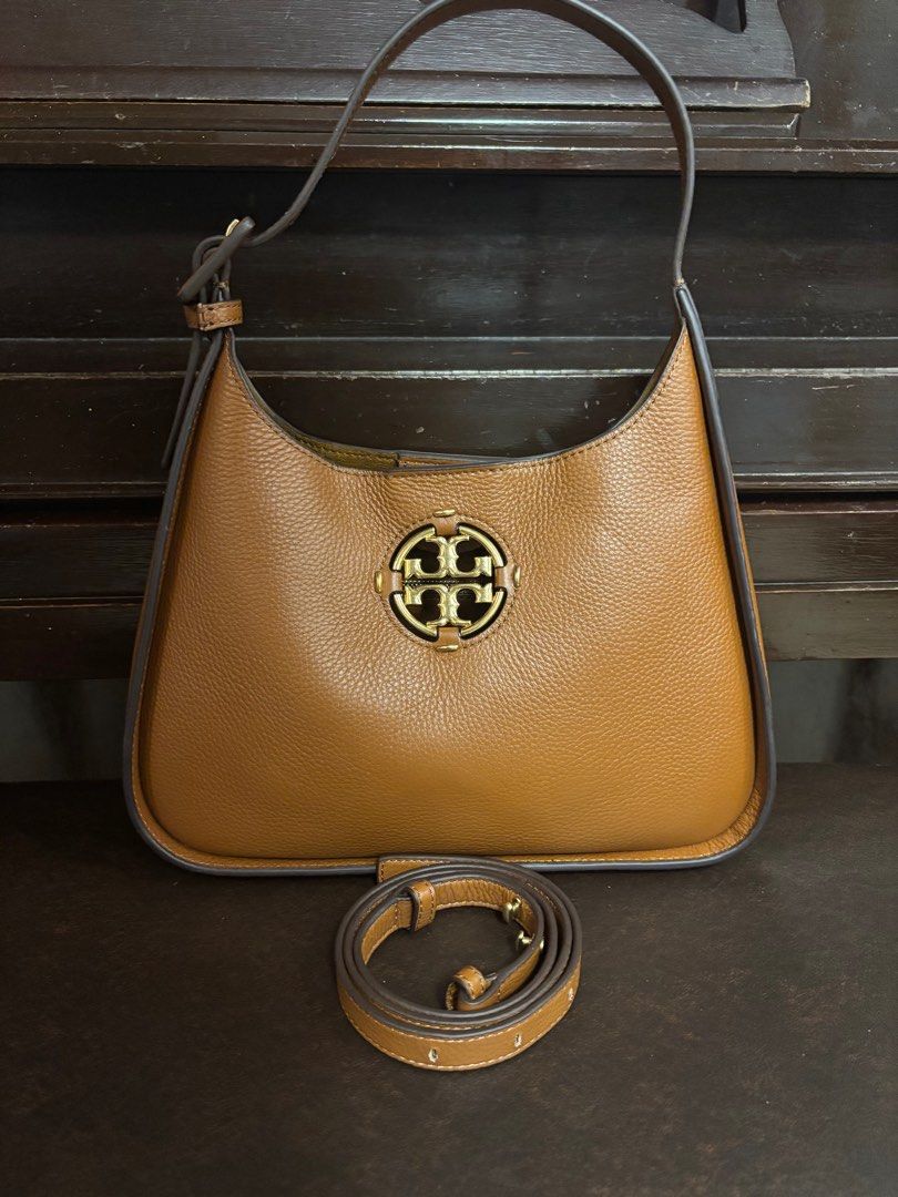 Tory Burch 2 way Leather bag (Category: Luxury Bags & Wallets) located in Imus. Submitted by bagsofblessings24 (Listing ID 1389671794, Image 1). Description: Preloved but like new Tory Burch Shoulder or sling/cross body bag Genuine leather, lightweight Excellent condition, no flaws, smells like new Medium size, can fit long wallet, snap closure Length 11in x Height 7in x Bottom 2.5in Pm to make reasonable offer With coded tag as authentic- not a 