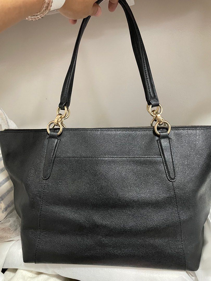 Authentic Coach Ava Crossgrain leather tote (Category: Luxury Bags & Wallets) located in Guiguinto. Submitted by prelovedinc2024 (Listing ID 1389850286, Image 2). Description: guaranteed authentic, bought in Japan with signs of use on hardwares gold hardwares - with fadings and scratches peeled off creed no rubs, no cracks, very clean last photo is only for reference size: 12.5x10.5x5”.