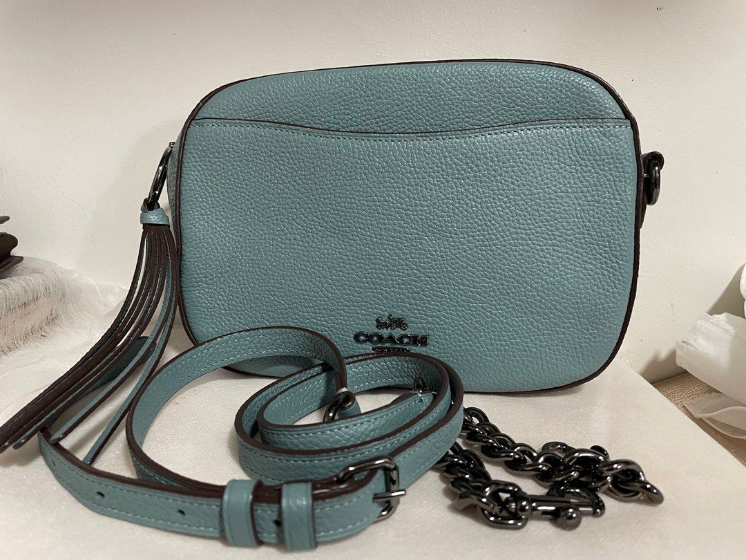 Authentic Coach Camera bag (Category: Luxury Bags & Wallets) located in Guiguinto. Submitted by prelovedinc2024 (Listing ID 1389879591, Image 1). Description: guaranteed authentic, bought in Japan only issue is the stain inside, other than that,the bag looks new gunmetal hardwares size: 8.5x6x3”.