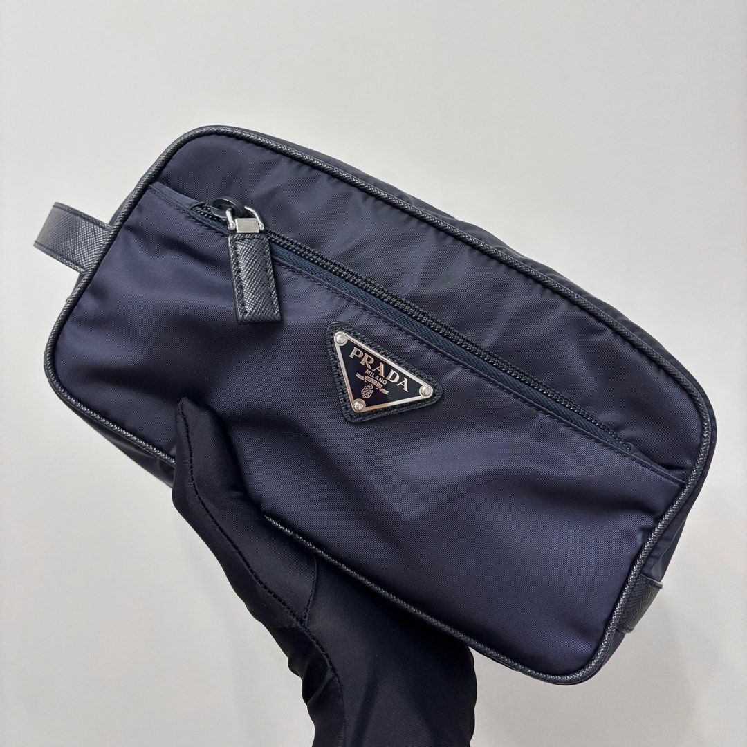 Authentic Prada Re-nylon Travel Pouch (Category: Luxury Bags & Wallets) located in Taguig. Submitted by slggg (Listing ID 1335310206, Image 1). Description: Never been used Prada Re-nylon Travel Pouch. ✔Microchipped ✔Can be checked using NFC tools Includes: - Dust bag - Authenticity Card Meet up: Taguig/BGC area.