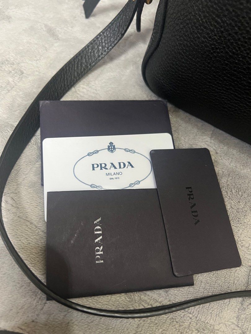 Authentic Prada Vitello Daino Camera Bag (Category: Luxury Bags & Wallets) located in Quezon City. Submitted by DZignersbyZsa (Listing ID 1389851245, Image 2). Description: Authentic Prada Vitello Daino Camera bag In very good condition comes with authenticity card and booklet clean in and out No corner rubs No tarnish on hardware ✨More detailed photos available upon request..