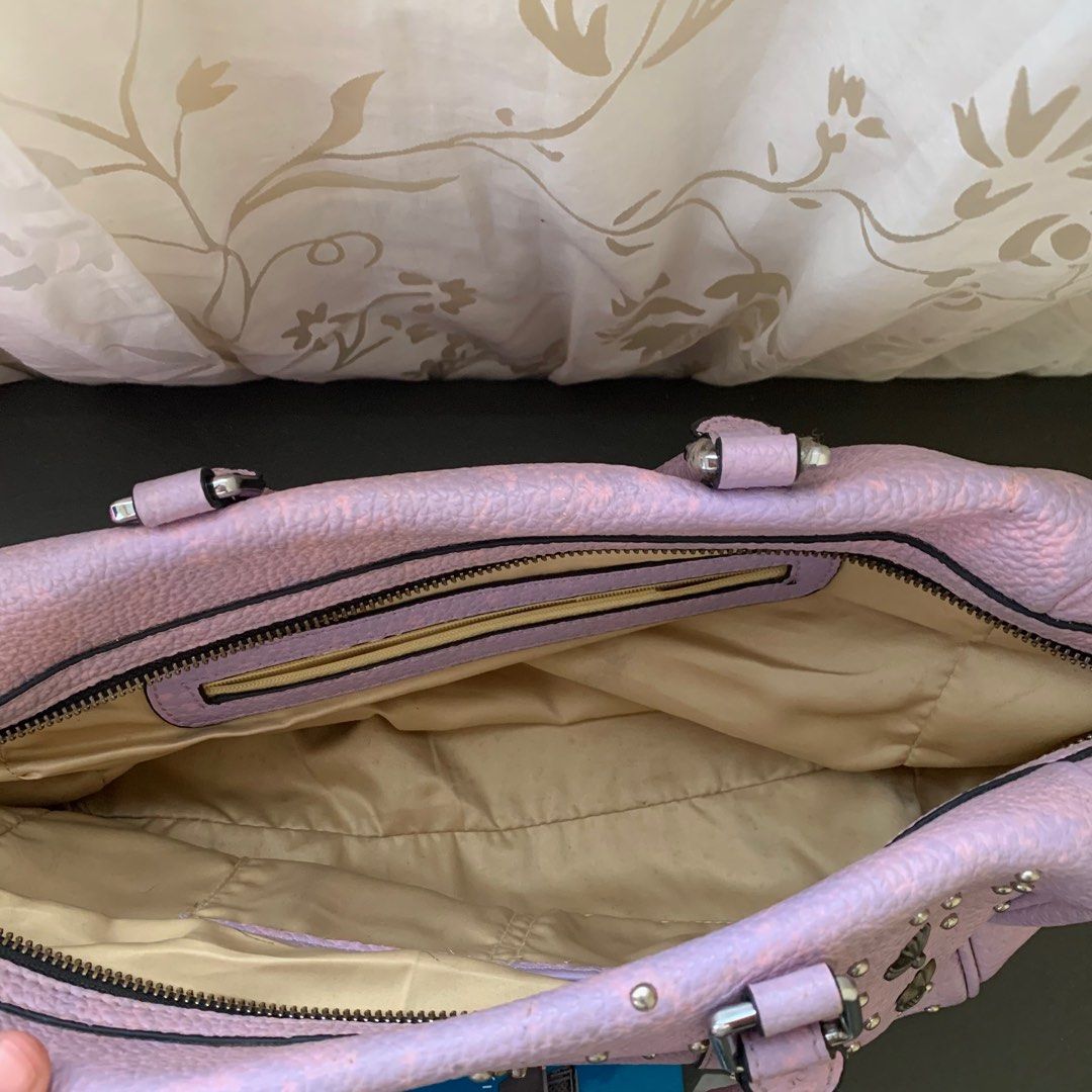 Chrome Hearts Studded Lilac-Pink Handbag (Category: Luxury Bags & Wallets) located in Rizal. Submitted by jcccc379 (Listing ID 1389906026, Image 3). Description: Unique and rare Chrome Hearts leather handbag in a lilac-pink shade. Features cross and fleur-de-lis studs all over, with signature Chrome Hearts detailing. Condition: • Preloved, with signs of use • Has a 1 missing stud • Scratch at the bottom part (only noticeable when bag is placed do