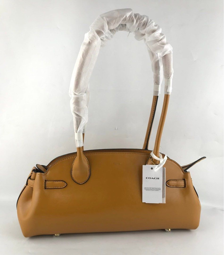 Coach Empire Carryall Hori Bag (Category: Shoulder Bags) located in Marikina City. Submitted by smthxtra (Listing ID 1390022449, Image 2). Description: Size: •Length: 13.5" •Height: 6.25" •Width: 4.75" Made in Cambodia - MPO Inside lanyard with dogleash clip Zip-top closure Four protective feet at base .
