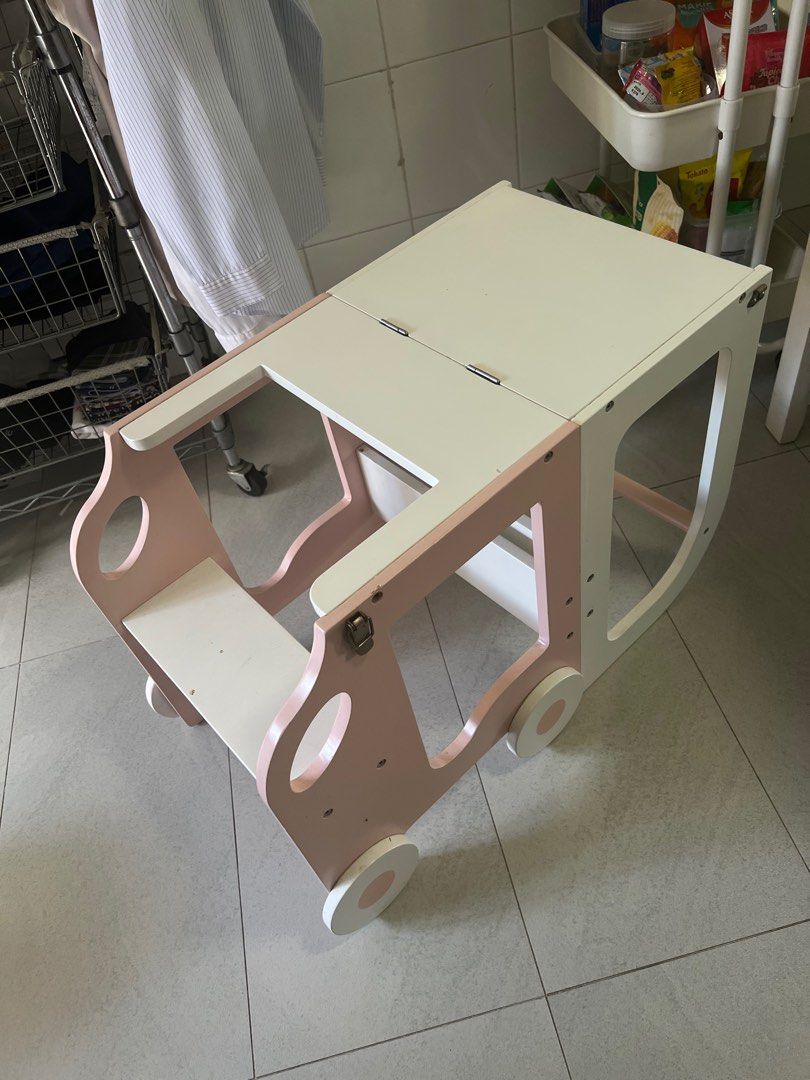 Foldable Learning Tower (Category: Other Kids Furniture) located in Singapore. Submitted by caterpiyarn (Listing ID 1389867327, Image 2). Description: Wooden learning tower that can be folded into kids desk. White and pink You can arrange your delivery or self collection .