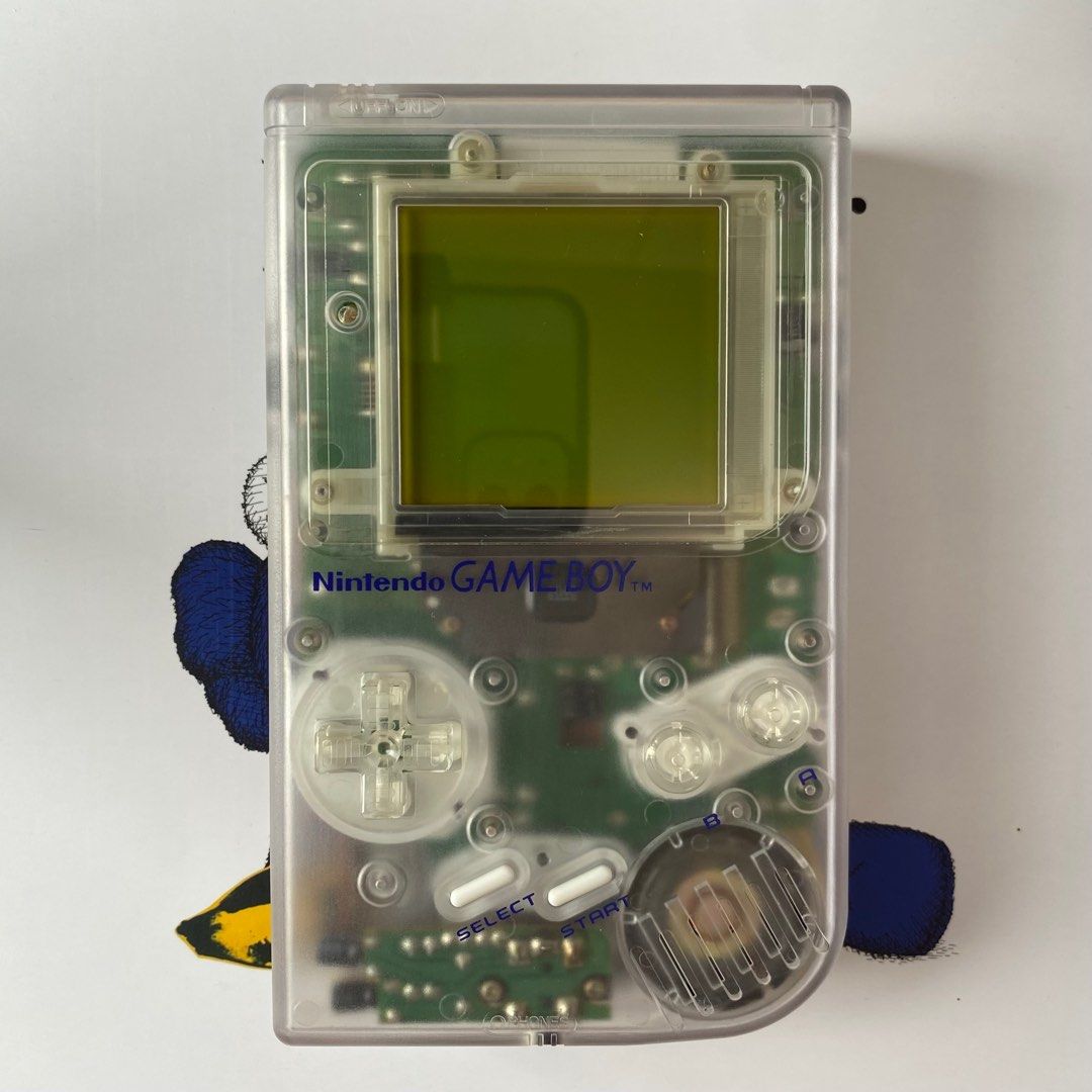 Game Boy (DMG) (Category: Nintendo) located in Pasig City. Submitted by mark_cedrick (Listing ID 1389875412, Image 1). Description: Classic original Game Boy (DMG model), fully functional and reshelled in a clear case. Features a glass screen lens for a cleaner look and better durability. 🎮 Fully working 🛠️ Reshelled in clear shell 🔍 Upgraded glass screen lens 📸 See photos for condition .