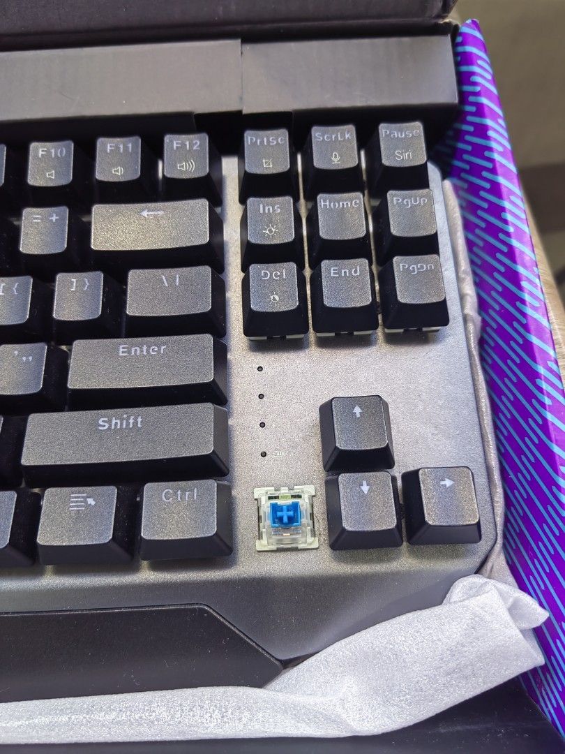 Machenike K7 Mechanical Keyboard - Blue Switches (Category: Computer Keyboard) located in Pasig City. Submitted by jmv_03 (Listing ID 1390014358, Image 3). Description: - Bought for Php 2k+ - Blue switches with ice blue backlight - Includes original box and cable - Used for a few months, mainly for school work - RFS: Decluttering; doesn't like blue switches 📍Location: Ortigas 💳 MOP: Maya, GCash, BPI 🚚 MOD: Lalamove or JRS.