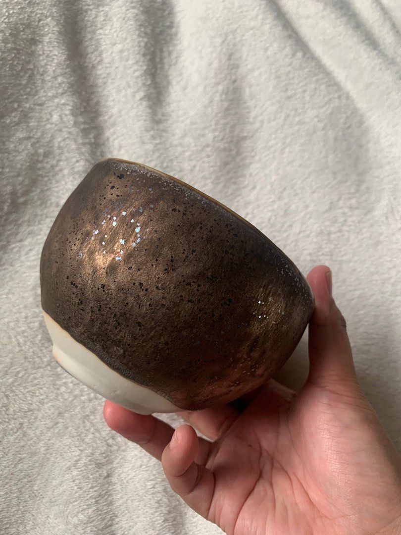 Matcha Bowl Chawan Bronze Shimmery Glazed (Category: Coffee & Tea Tableware) located in Manila. Submitted by gabagoolz (Listing ID 1389895361, Image 1). Description: Super pretty in person! When the light catches the bowl it shimmers because of its glittery glazing. Thick and heavy. Standard size of a matcha bowl. Perfect for usucha.