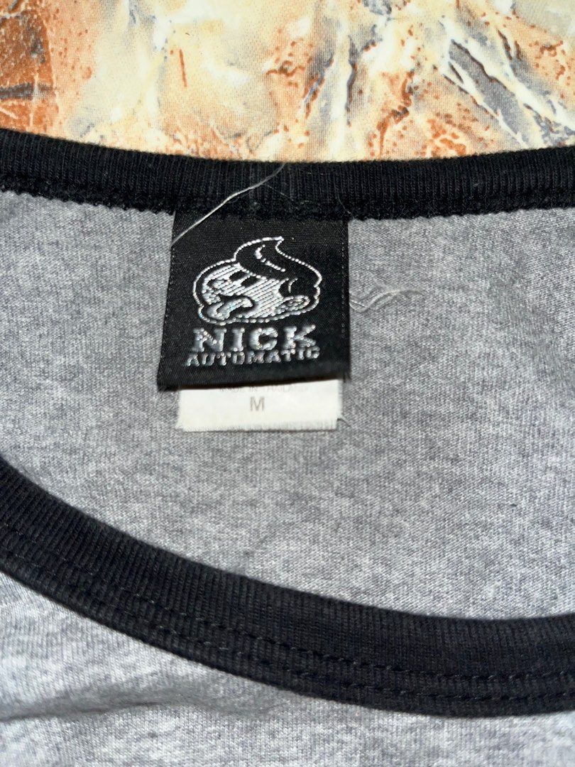 Nick Automatic Raglan Graphic Shirt (Category: Tshirts & Polo Shirts ) located in San Luis. Submitted by haggle.apparel (Listing ID 1389931505, Image 2). Description: Nick Automatic Raglan Graphic Shirt (Legit) Measurements: W-18 / L- 25 Condition: Used but not noticeable. No issues DM to inquire (NEGOTIABLE).