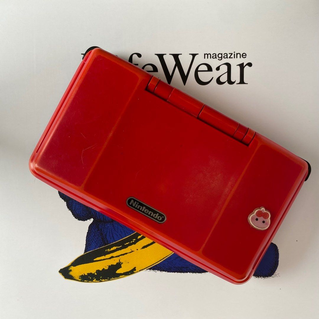 Original Nintendo DS (Phat) – Red (Category: Nintendo) located in Pasig City. Submitted by mark_cedrick (Listing ID 1389876682, Image 2). Description: Classic red Nintendo DS “Phat” model in working condition. Shows some discoloration from age and surface scratches from normal use. Top screen still has its original screen protector. Includes original stylus (slightly bent) but still usable. 🎮 Fully functional 🟥 Red shell with visible aging/disc