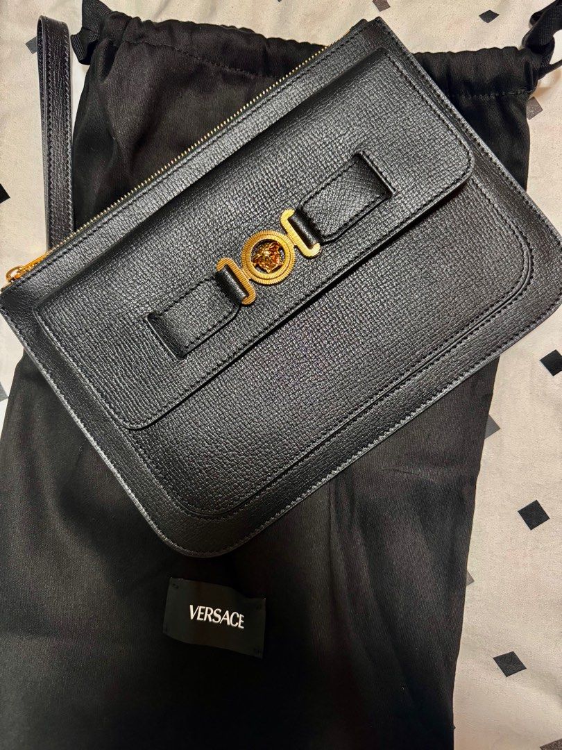 Versace Medusa Clutch (Category: Luxury Bags & Wallets) located in Malabon City. Submitted by ncdavadilla (Listing ID 1390020212, Image 1). Description: Brand new. Black color. Calf leather. SRP P73500. With dustbag and paper bag.