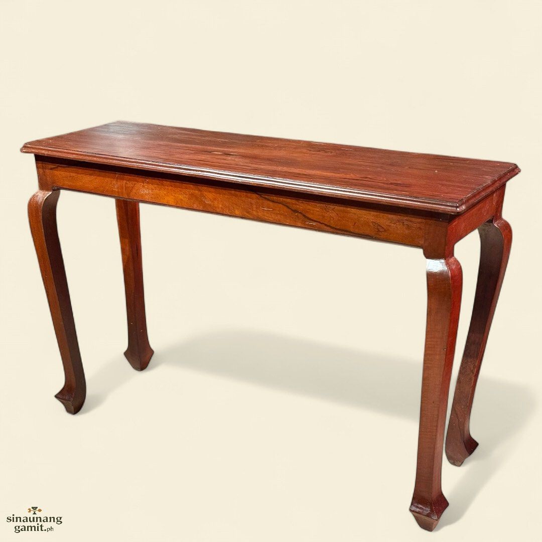 Vintage Kamagong Console Table (Category: Tables & Sets) located in Manila. Submitted by sinaunang_gamit (Listing ID 1389896104, Image 1). Description: Vintage Kamagong Console Table Length: 48 inches Height: 32 inches Width: 16 inches Sturdy and ready to use 4pcs available 9500 each.