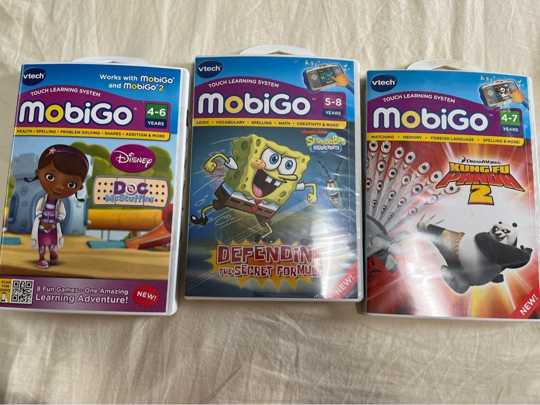Vtech Mobigo Games (Category: Educational & Learning Toys) located in Manila. Submitted by carol11111 (Listing ID 1389890404, Image 1). Description: Mobigo Games Doc McStuffins - Slightly used Spongebob - New - sealed Kung Fu Panda 2 - New - sealed.