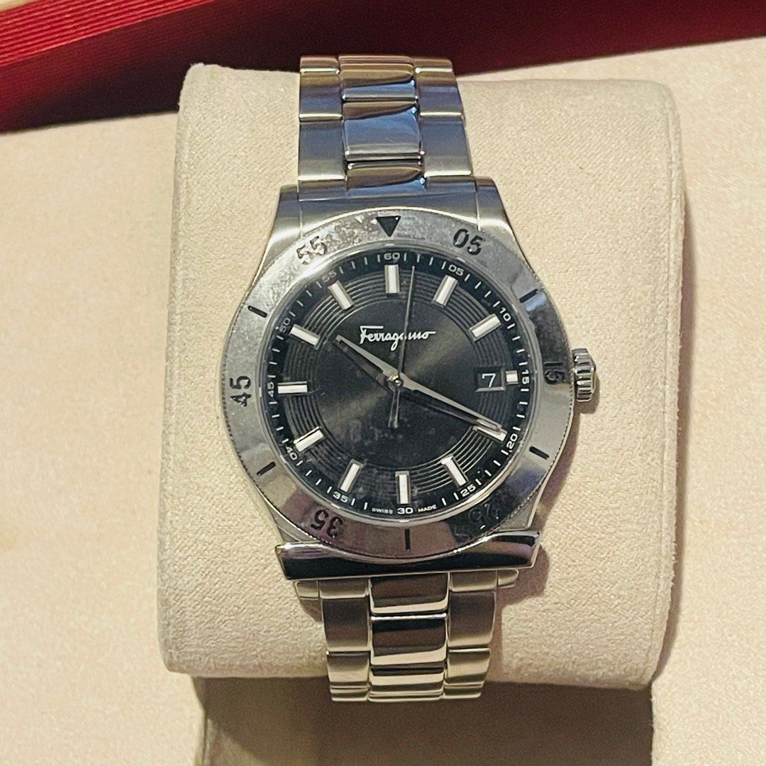 Luxury Ferragamo watch in presentation box (Category: Luxury Watches) located in Muntinlupa City. Submitted by jnjsluxury (Listing ID 1384661441, Image 2). Description: Ferragamo FH1 Men’s Luxury Stainless Steel Watch – Mint Condition SWISS Made ₱18,000 (Slightly Negotiable) Brand: Salvatore Ferragamo Model/Series: FH1 Quartz (Ref: FH1-101704710497) Case Material: Stainless Steel Bracelet Material: Stainless Steel, Original Ferragamo Links Dial C