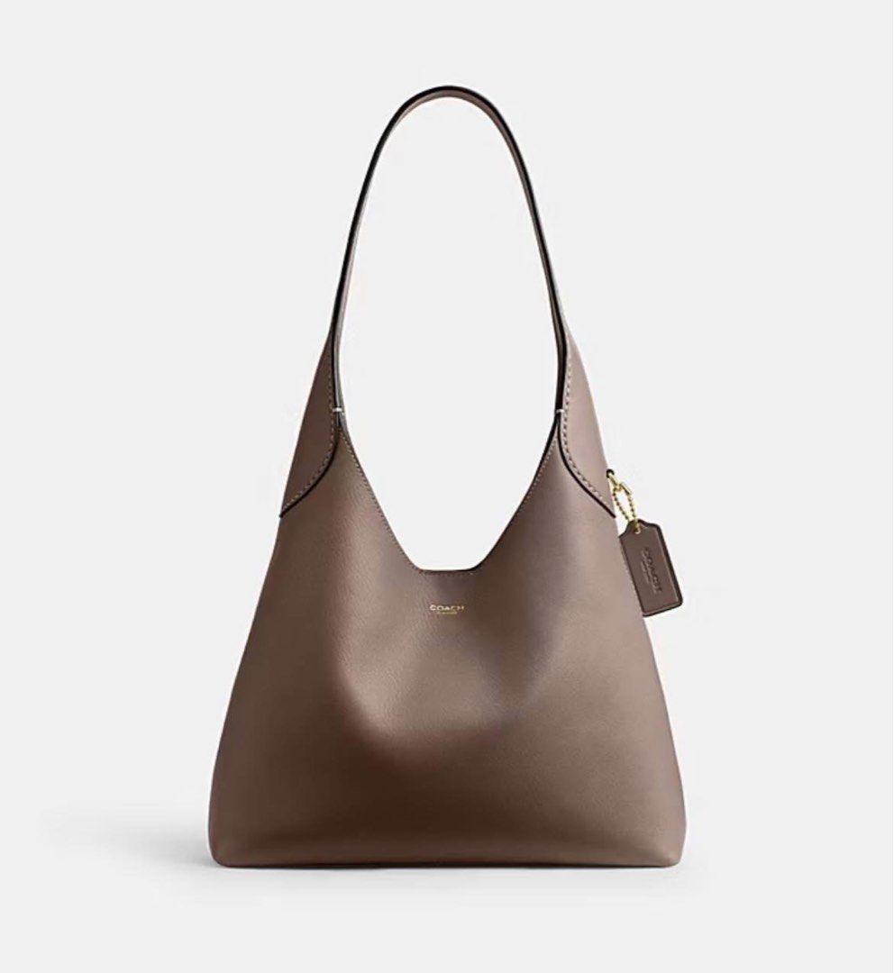 💯ORIGINAL COACH BROOKLYN 28 DARK STONE (Category: Luxury Bags & Wallets) located in Quezon City. Submitted by ashongsstore (Listing ID 1384785355, Image 2). Description: ✨NEW ARRIVALS✨ 🇵🇭AVAILABLE🇵🇭 BROOKLYN SHOULDER BAG 28 DARK STONE Ready to Ship PM us to order 💕 Our Brooklyn is an elegant, minimalist silhouette—with a distinctly New York attitude. Smaller than the 39, the hobo style is crafted of natural grain leather with beautiful text