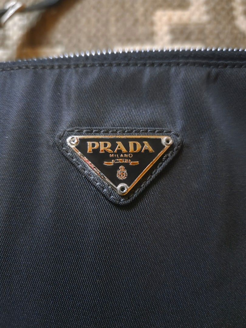 Prada Borsa Tesutto Box Bag (Category: Luxury Bags & Wallets) located in Mandaluyong City. Submitted by the_luxury_hub (Listing ID 1384832440, Image 2). Description: vintage 1998 Prada Borsa Tesutto Box shoulder bag with minor signs of usage no damage on fabric even on edges leather lining inside is still in great condition with slight damage on logo (see photo for reference) strap is still intact with authenticity card.
