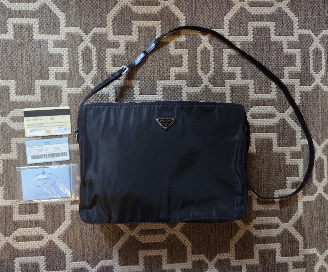 Prada Borsa Tesutto Box Bag (Category: Luxury Bags & Wallets) located in Mandaluyong City. Submitted by the_luxury_hub (Listing ID 1384832440, Image 1). Description: vintage 1998 Prada Borsa Tesutto Box shoulder bag with minor signs of usage no damage on fabric even on edges leather lining inside is still in great condition with slight damage on logo (see photo for reference) strap is still intact with authenticity card.
