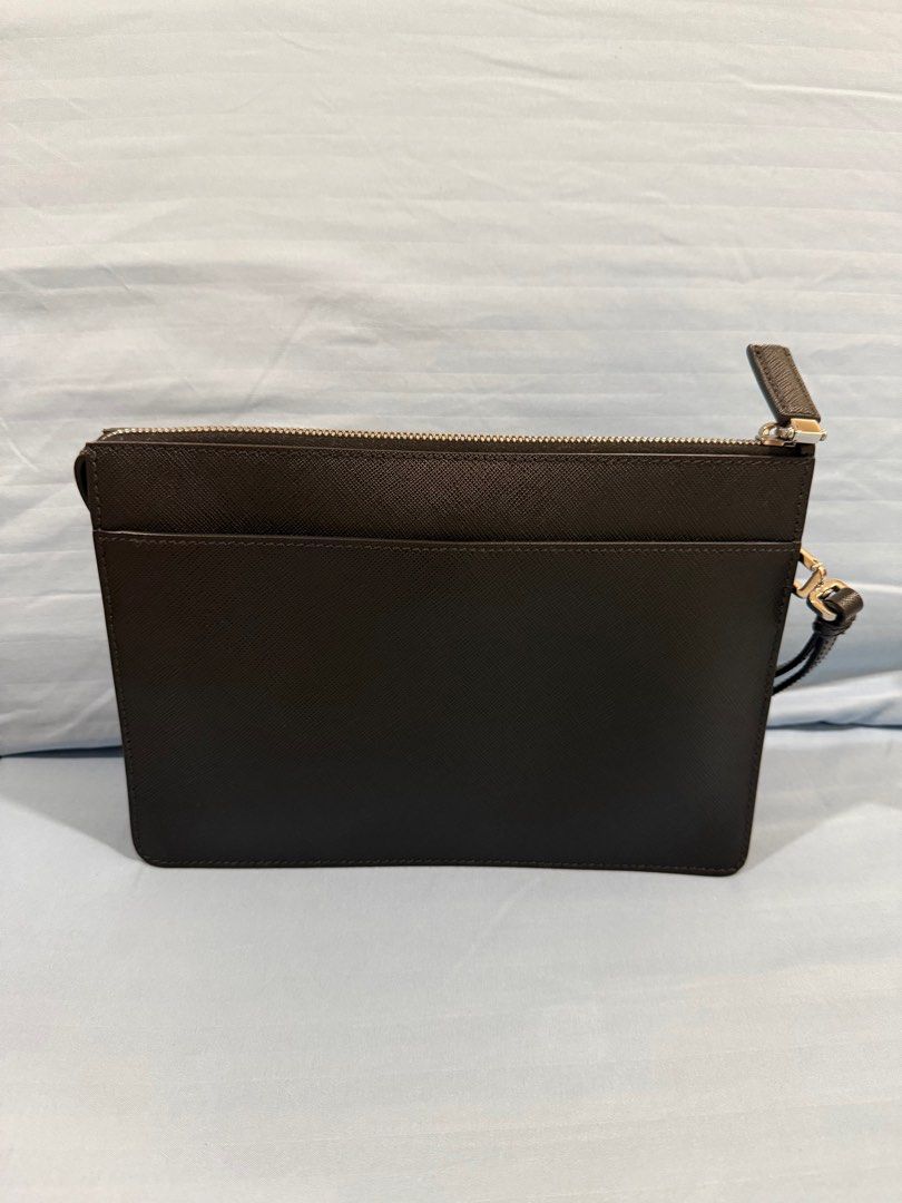 Prada Clutch Bag (Category: Luxury Bags & Wallets) located in Manila. Submitted by gmelendres18 (Listing ID 1384797116, Image 2). Description: Prada Clutch Bag With dust bag and cards Purchased from Barcelona. Not outlet item Srp: 125,000 pesos.