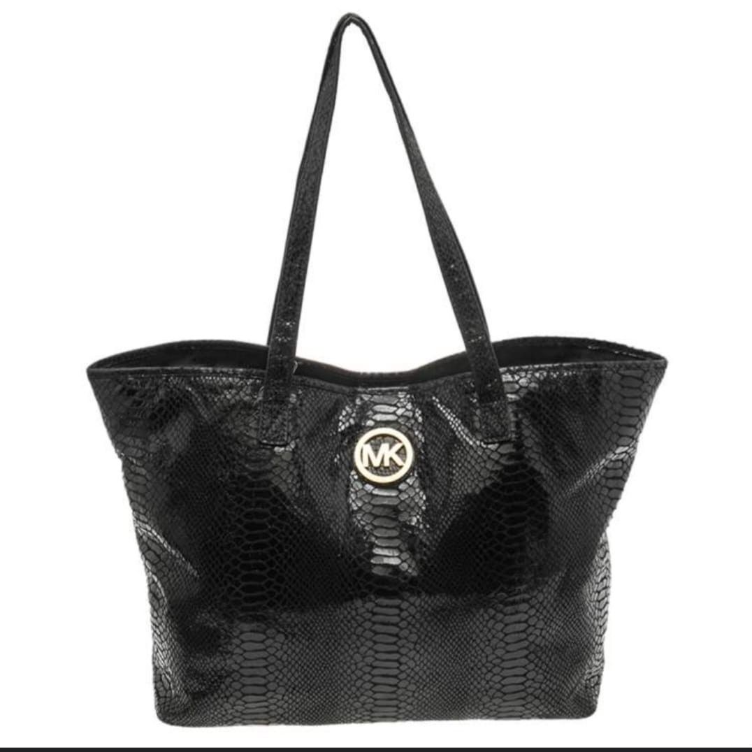 Authentic Michael Kors python tote bag (Category: Bags & Wallets) located in Singapore. Submitted by preloved_to_beloved (Listing ID 1384988968, Image 1). Description: Michael Kors tote bag - 100% Authentic - Black - Gold metal hardware - Fits A4 size - 4 interior slot pockets - 1 interior zip pocket - 1 exterior slot pocket (back) Fabric: - Suede - Python patent leather Measurements: - Width: 48cm (top) - Width: 35cm (bottom) - Height: 30cm - De
