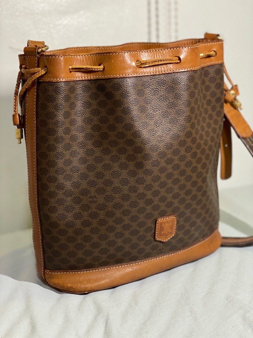 Céline Macadam Drawstring Bucket Bag Brown (Category: Luxury Bags & Wallets) located in San Fernando. Submitted by jacob108 (Listing ID 1385020657, Image 1). Description: 🤎 AUTHENTIC CÉLINE Macadam Drawstring Bucket Bag – Brown – Vintage from Japan 🇯🇵 • ✅ 100% Authentic – Sourced from Japan, verified vintage • 👜 Classic Macadam Pattern – Iconic Céline design in rich brown tones • 🧵 Coated Canvas & Leather Trim – Durable yet elegant • 🪢 Draw