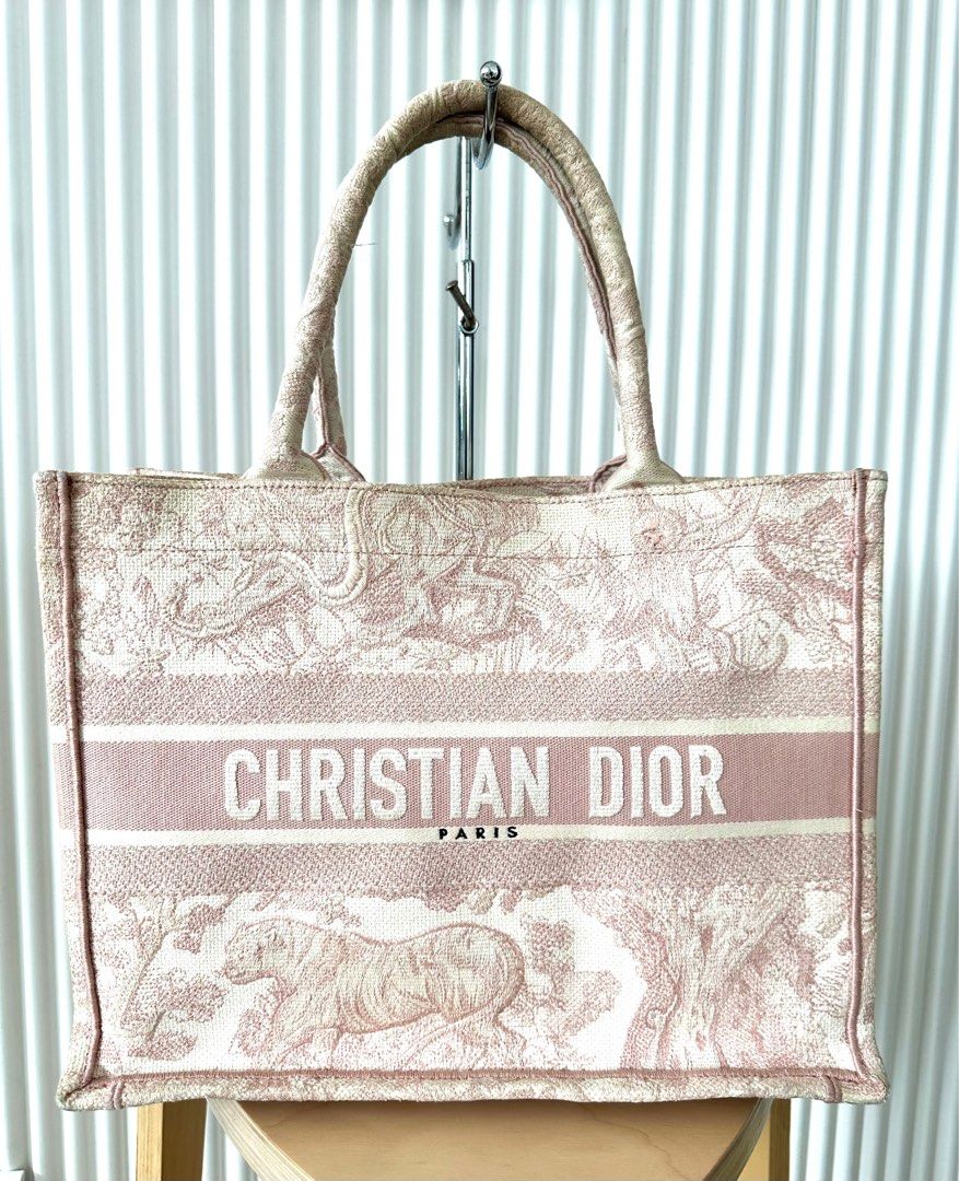 Dior book tote medium with COA (Category: Luxury Bags & Wallets) located in Quezon City. Submitted by nancdmd (Listing ID 1384886578, Image 1). Description: PRICE SLASH FOR THIS SEASON!!! FROM 50k to 40k!!! Selling low! Dior book tote in medium size for sale Personalized with name Signs of use evident .
