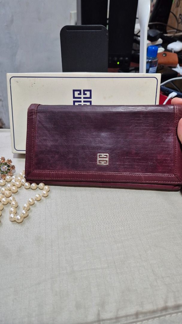 Givenchy Long wallet (Category: Luxury Bags & Wallets) located in Imus. Submitted by tan_gerine389 (Listing ID 1384964145, Image 2). Description: Givenchy Long Wallet ⚘genuine leather ⚘with sign of use and need some cleaning ⚘maroon colour ⚘980 Pesos + sf ⚠️Please take time to read ⚠️Item is Japan ukay source , please manage your expectations, if there is any, flaws and other signs of usage are stated, mine means sold, no return/no exchange polic