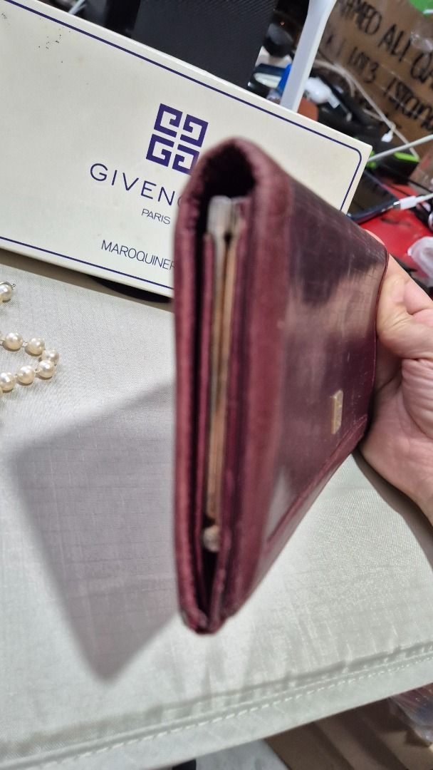 Givenchy Long wallet (Category: Luxury Bags & Wallets) located in Imus. Submitted by tan_gerine389 (Listing ID 1384964145, Image 3). Description: Givenchy Long Wallet ⚘genuine leather ⚘with sign of use and need some cleaning ⚘maroon colour ⚘980 Pesos + sf ⚠️Please take time to read ⚠️Item is Japan ukay source , please manage your expectations, if there is any, flaws and other signs of usage are stated, mine means sold, no return/no exchange polic