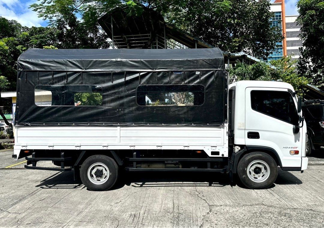 HYUNDAI HD45 GT 4W (Category: Heavy Vehicles) located in Pasig City. Submitted by tycoon.cars (Listing ID 1384910103, Image 3). Description: HYUNDAI HD45 GT 4W - 2022 Model - 3,XXX Original Mileage - 14-footer Dropside - Creamy White - Manual Transmission - 2.8L Diesel Engine - SUPER FRESH - RARE UNIT We Don’t Sell Cars, We Sell Dreams. BUY•SELL•TRADE•CONSIGN•FINANCING Tycoon Powercars www.tycoonpowercars.com Autocamp #100 Ortigas Avenue, Pasig C