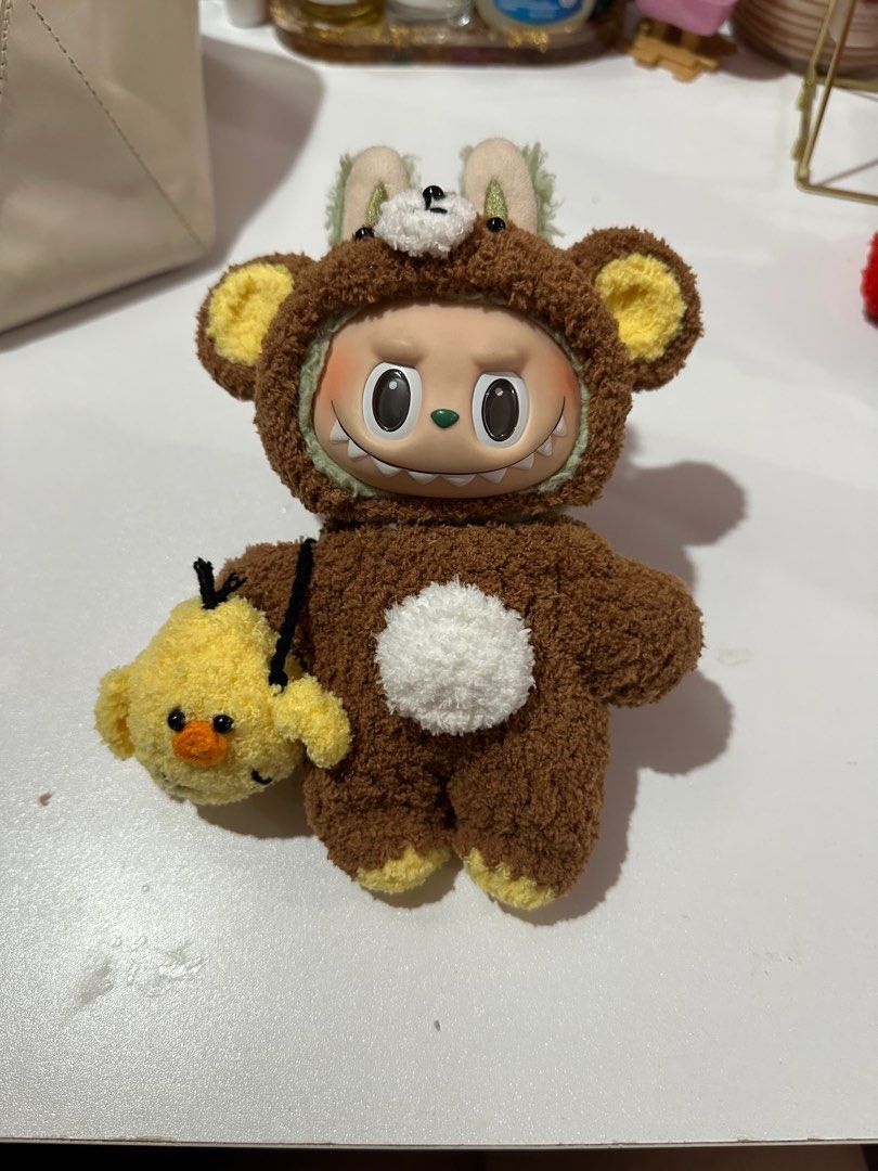 Labubu Clothe - RILAKKUMA OUTFIT (Category: Babies & Kids Fashion) located in Quezon City. Submitted by m.heart (Listing ID 1384988462, Image 1). Description: Labubu Rilakkuma Outfit 🤎💛 > with: bear hat, outfit, yellow bird bag (kiiroitori) > BRAND NEW!.