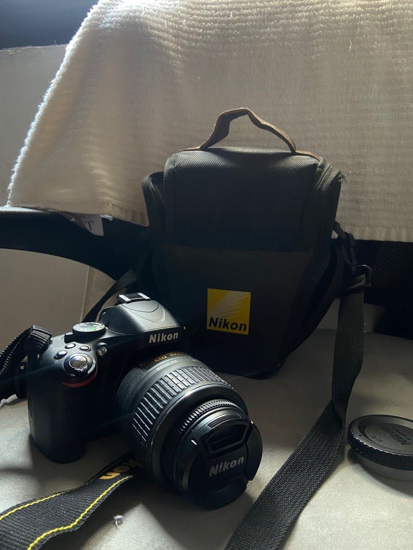 Nikon D5100 (Category: Cameras) located in Cavite. Submitted by kwongjna (Listing ID 1384862855, Image 1). Description: The Nikon D5100 is an APS-C DSLR camera released in 2011 with a 16.2-megapixel sensor. It features a 3-inch vari-angle LCD monitor, 1080p video recording, and an ISO range of 100-6400 (expandable to 25600). The camera also offers 11 autofocus points, 4fps continuous shooting, and various in-camera effects With camera bag and bat