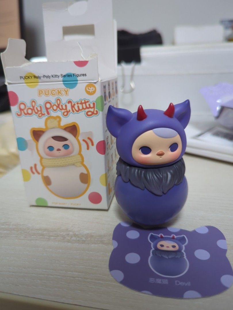 Poly Poly Kitty - Devil (Category: Designer & Blind Box Toys) located in Singapore. Submitted by winter077 (Listing ID 1385007349, Image 2). Description: - Adorable purple monster figure - Features horns and a fluffy collar - Excellent condition - Great for collectors or desk decoration Negotiable .