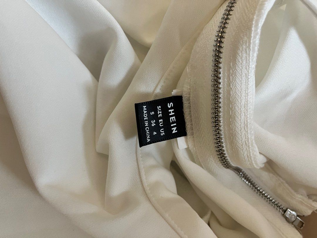 shein white asymmetrical one-shoulder top with layered dramatic ruffle (Category: Others Tops) located in Manila. Submitted by shopthisstuff (Listing ID 1385005496, Image 3). Description: never used ; just washed.