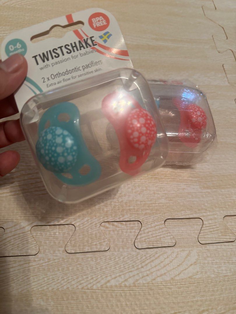TwistShake 2 Pack Orthodontic Pacifiers (Category: Soothers & Pacifiers) located in Angeles City. Submitted by mystiquemayhem (Listing ID 1384924415, Image 1). Description: ✅ Trusted by moms. Loved by babies. ⸻ 💖 Orthodontic Design Supports healthy oral development and reduces the risk of misaligned teeth. ⸻ 🌬️ Gentle on Skin Soft silicone nipple + ventilation holes to prevent rashes and irritation. ⸻ 👶 Perfect for Newborns & Up Designed for b