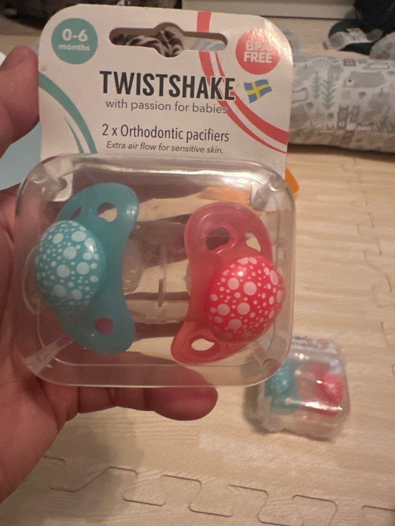 TwistShake 2 Pack Orthodontic Pacifiers (Category: Soothers & Pacifiers) located in Angeles City. Submitted by mystiquemayhem (Listing ID 1384924415, Image 2). Description: ✅ Trusted by moms. Loved by babies. ⸻ 💖 Orthodontic Design Supports healthy oral development and reduces the risk of misaligned teeth. ⸻ 🌬️ Gentle on Skin Soft silicone nipple + ventilation holes to prevent rashes and irritation. ⸻ 👶 Perfect for Newborns & Up Designed for b