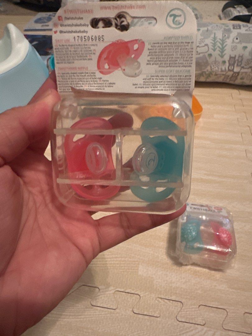 TwistShake 2 Pack Orthodontic Pacifiers (Category: Soothers & Pacifiers) located in Angeles City. Submitted by mystiquemayhem (Listing ID 1384924415, Image 3). Description: ✅ Trusted by moms. Loved by babies. ⸻ 💖 Orthodontic Design Supports healthy oral development and reduces the risk of misaligned teeth. ⸻ 🌬️ Gentle on Skin Soft silicone nipple + ventilation holes to prevent rashes and irritation. ⸻ 👶 Perfect for Newborns & Up Designed for b